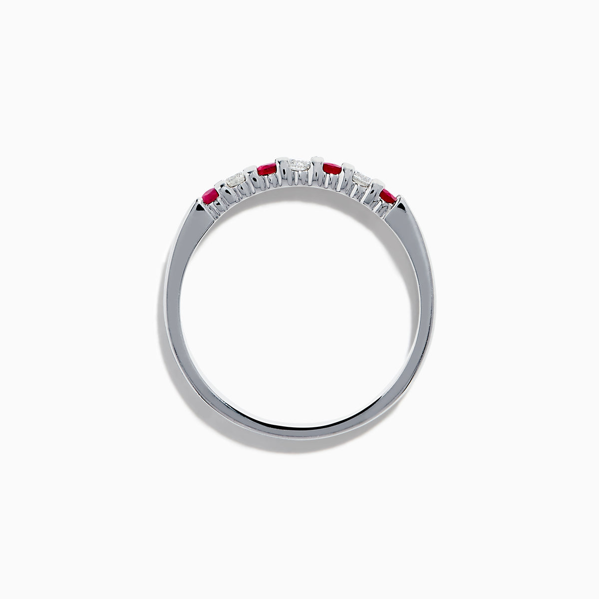 The 14K White Gold 7-Stone Ruby & Diamond Band, 0.25 TCW, showcases alternating vivid red rubies and sparkling round white diamonds set in a row along the band, shown on a white background.