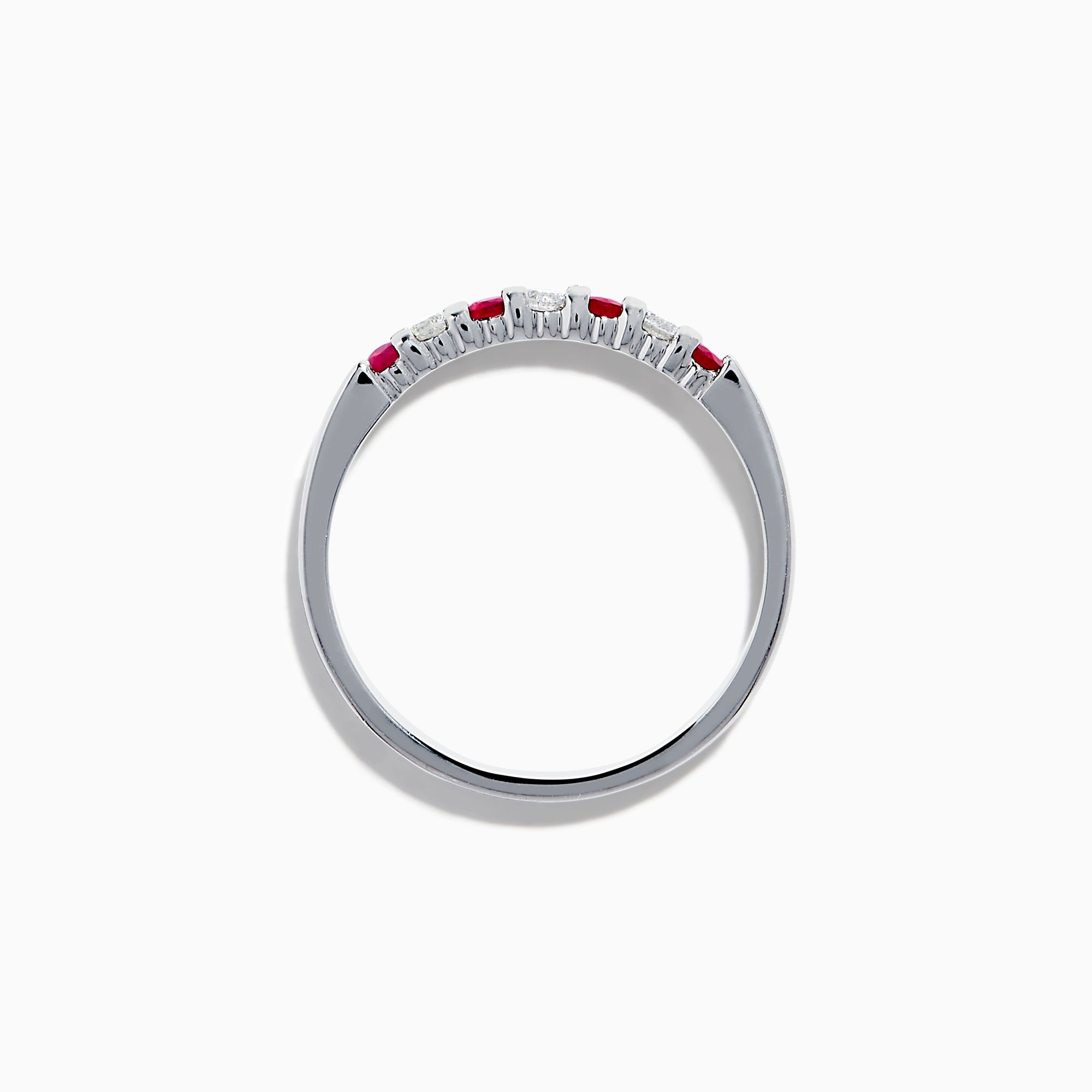 The 14K White Gold 7-Stone Ruby & Diamond Band, 0.25 TCW, showcases alternating vivid red rubies and sparkling round white diamonds set in a row along the band, shown on a white background.