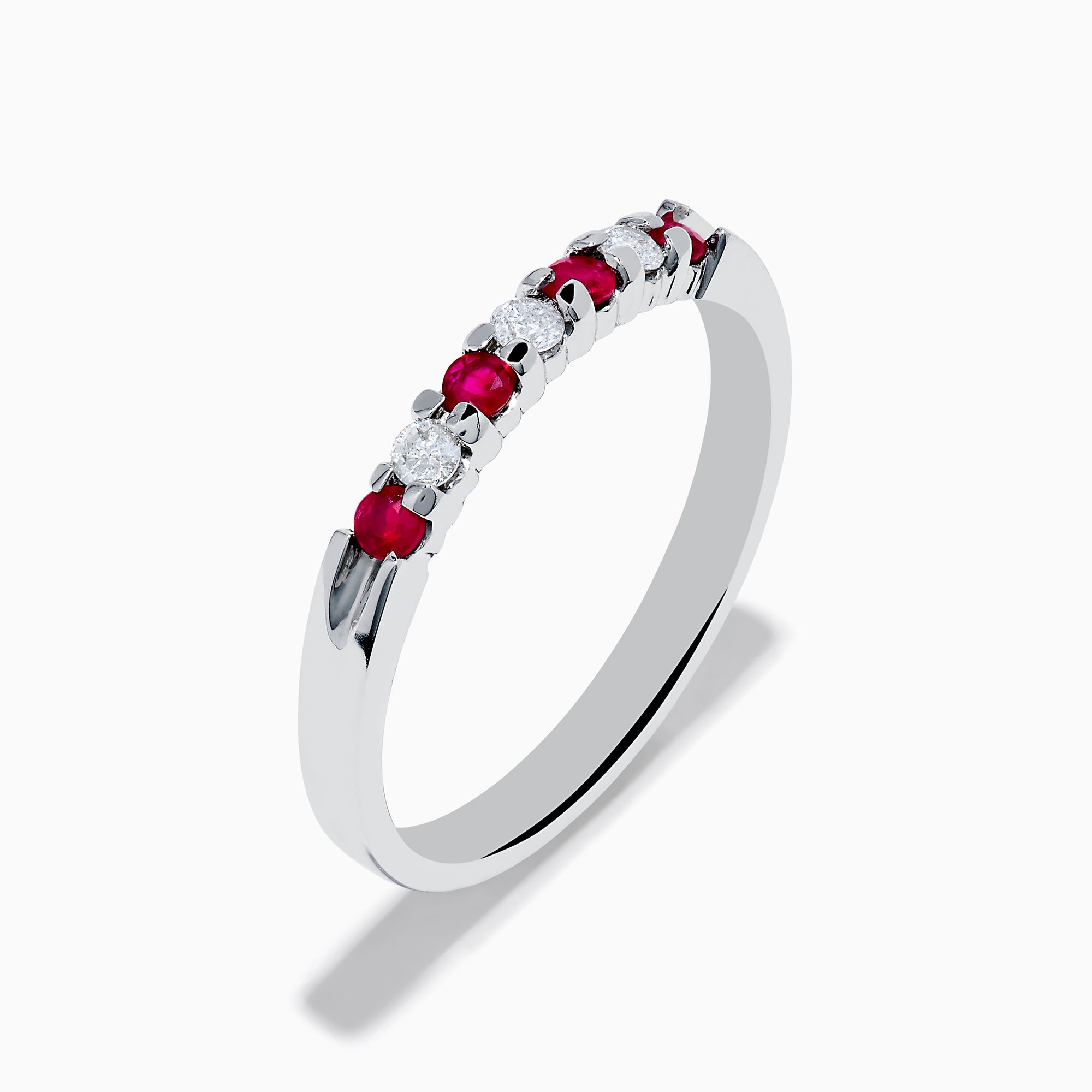 The 14K White Gold 7-Stone Ruby & Diamond Band, 0.25 TCW, showcases alternating vivid red rubies and sparkling round white diamonds set in a row along the band, shown on a white background.