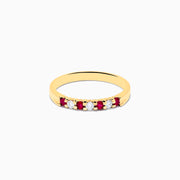 The 14K Yellow Gold 7-Stone Ruby & Diamond Band, 0.25 TCW, features an alternating row of round white diamonds and vibrant rubies set across the band.
