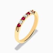 The 14K Yellow Gold 7-Stone Ruby & Diamond Band, 0.25 TCW, features an alternating row of round white diamonds and vibrant rubies set across the band.