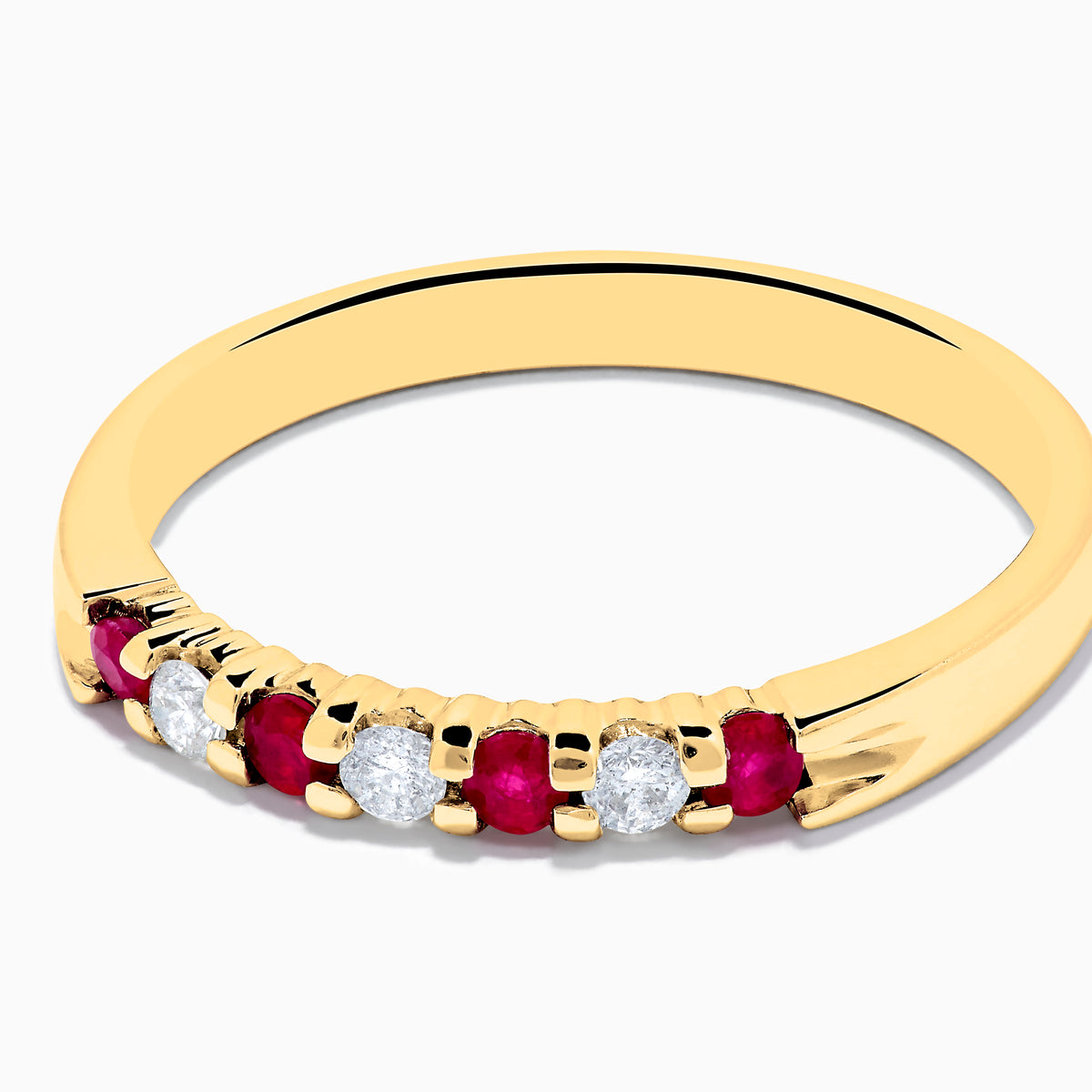 The 14K Yellow Gold 7-Stone Ruby & Diamond Band, 0.25 TCW, features an alternating row of round white diamonds and vibrant rubies set across the band.