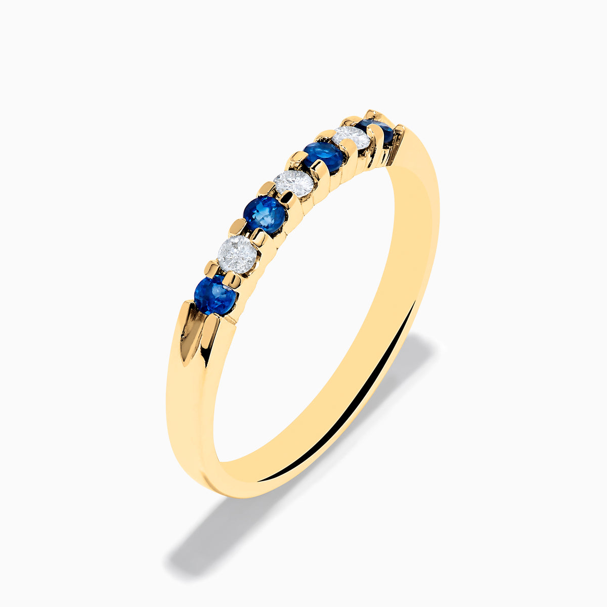 The 14K Yellow Gold 7-Stone Blue Sapphire & Diamond Band (0.25 TCW) features alternating blue sapphires and diamonds set in a row on the band, shown against a plain white background.