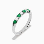 The 14K White Gold 7-Stone Emerald & Diamond Band, 0.50 TCW, showcases alternating round green emeralds and white diamonds on a plain white background.