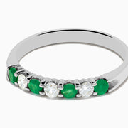 The 14K White Gold 7-Stone Emerald & Diamond Band, 0.50 TCW, showcases alternating round green emeralds and white diamonds on a plain white background.