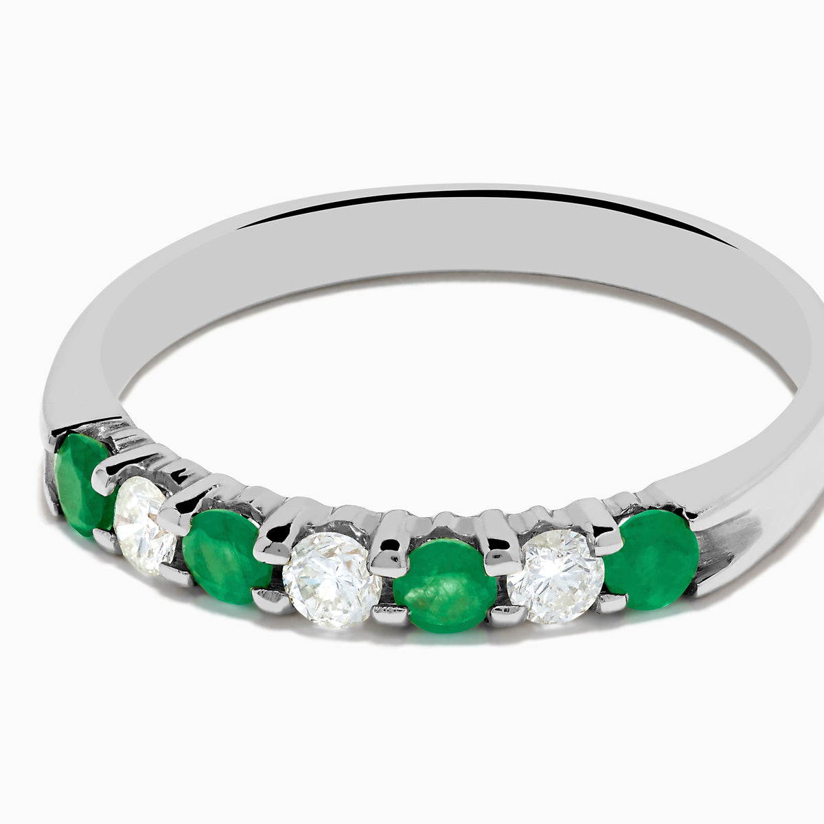 The 14K White Gold 7-Stone Emerald & Diamond Band, 0.50 TCW, showcases alternating round green emeralds and white diamonds on a plain white background.