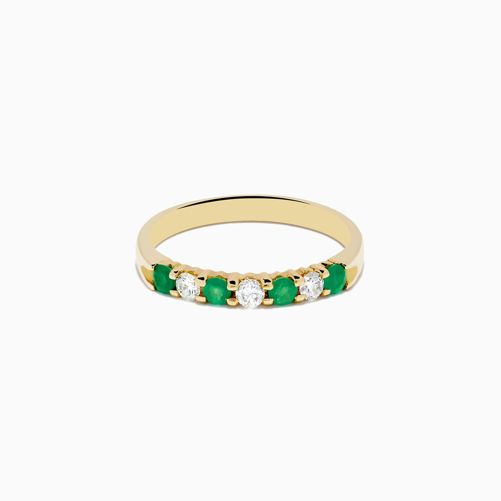 The 14K Yellow Gold 7-Stone Emerald & Diamond Band, 0.50 TCW, features alternating round green emeralds and clear diamonds in a row along the band, displayed on a plain white background.