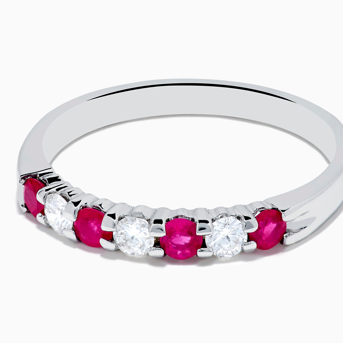 The 14K White Gold 7-Stone Ruby & Diamond Band, 0.50 TCW, showcases alternating round white diamonds and vibrant rubies on the front half of the band, set against a plain white background.