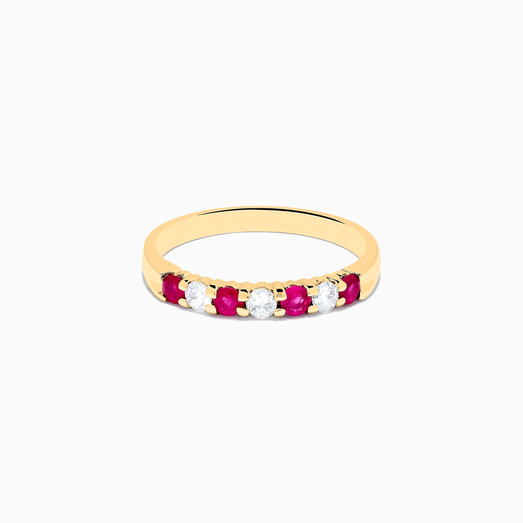 The 14K Yellow Gold 7-Stone Ruby & Diamond Band, 0.50 TCW, features four round rubies and three round diamonds set alternately in a row on the band.
