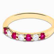 The 14K Yellow Gold 7-Stone Ruby & Diamond Band, 0.50 TCW, features four round rubies and three round diamonds set alternately in a row on the band.