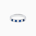 The 14K White Gold 7-Stone Blue Sapphire & Diamond Band (0.50 TCW) features alternating blue sapphires and diamonds set in a row, shown on a white background.