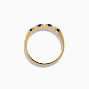 The 14K Yellow Gold 7-Stone Blue Sapphire & Diamond Band (0.50 TCW) features alternating sapphires and diamonds set in a row along the band, making it a striking accessory for any occasion. Displayed on a white background.