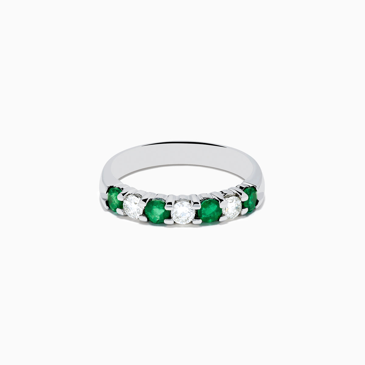 The 14K White Gold 7-Stone Emerald & Diamond Band (0.65 TCW) features alternating round emerald and diamond gemstones set in a row, displayed against a white background.