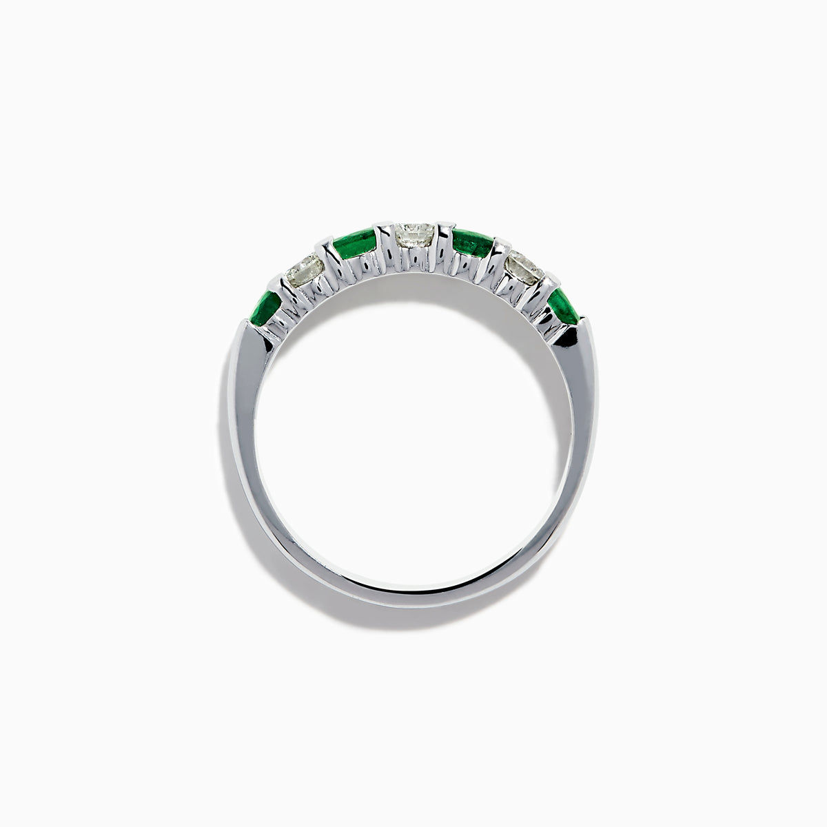 The 14K White Gold 7-Stone Emerald & Diamond Band (0.65 TCW) features alternating round emerald and diamond gemstones set in a row, displayed against a white background.