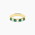 The 14K Yellow Gold 7-Stone Emerald & Diamond Band, 0.65 TCW, features alternating round green emeralds and white diamonds set in a row along the band, shown against a plain white background.