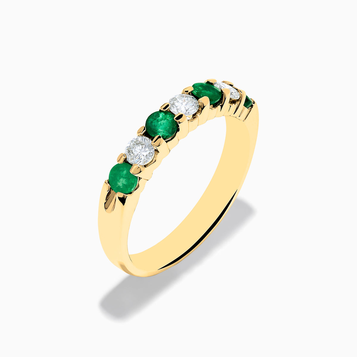 The 14K Yellow Gold 7-Stone Emerald & Diamond Band, 0.65 TCW, features alternating round green emeralds and white diamonds set in a row along the band, shown against a plain white background.