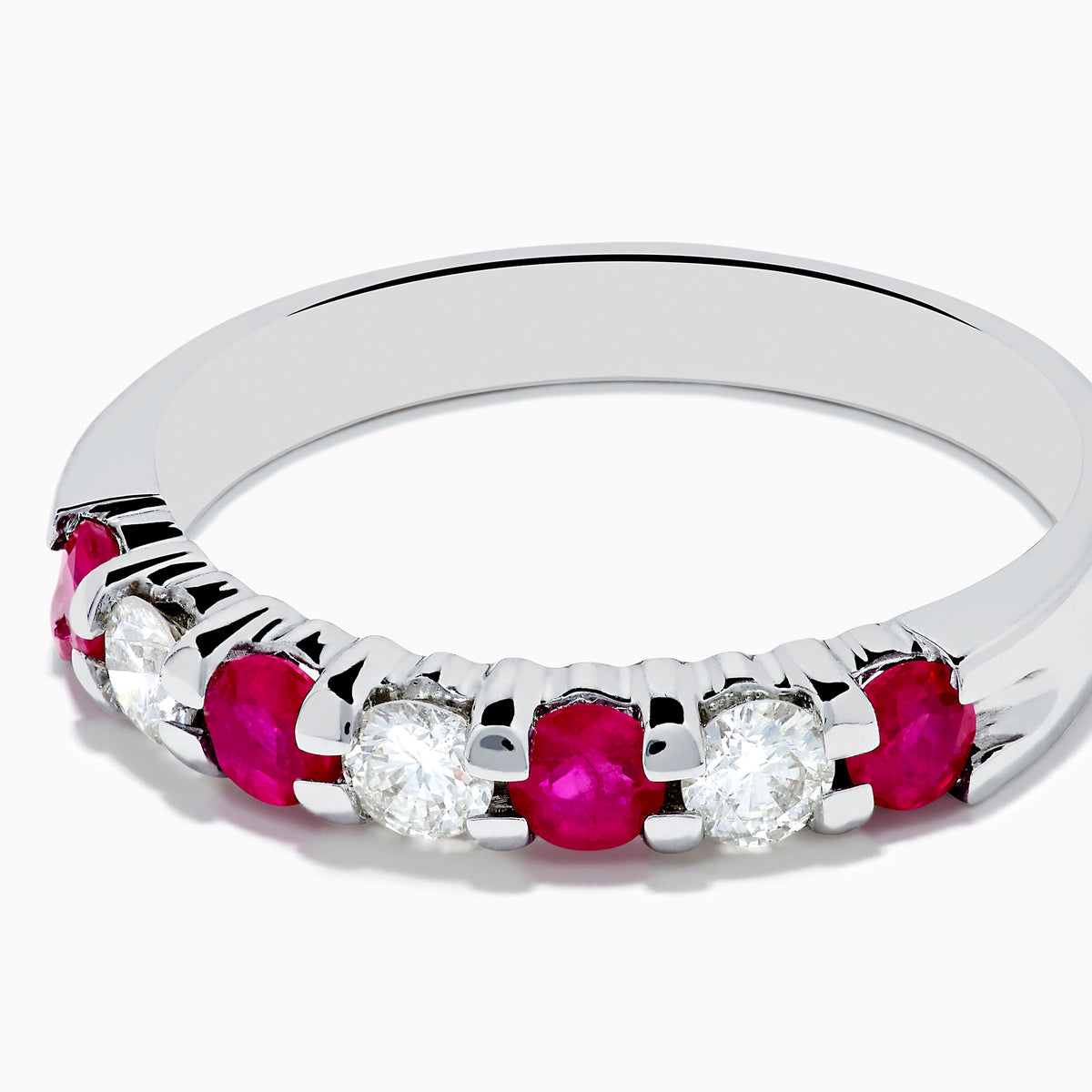 The 14K White Gold 7-Stone Ruby & Diamond Band, 0.65 TCW, features alternating round rubies and sparkling diamonds, showcased on a white background.