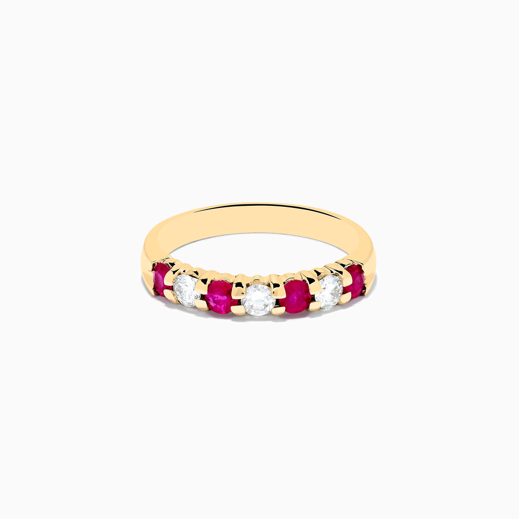The 14K Yellow Gold 7-Stone Ruby & Diamond Band, 0.65 TCW, showcases alternating round rubies and diamonds set in a row along the band, displayed against a plain white background.