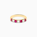 The 14K Yellow Gold 7-Stone Ruby & Diamond Band, 0.65 TCW, showcases alternating round rubies and diamonds set in a row along the band, displayed against a plain white background.