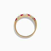 The 14K Yellow Gold 7-Stone Ruby & Diamond Band, 0.65 TCW, showcases alternating round rubies and diamonds set in a row along the band, displayed against a plain white background.