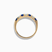 The 14K Yellow Gold 7-Stone Blue Sapphire & Diamond Band, 0.65 TCW, features alternating round blue sapphires and white diamonds set in a row along the band.