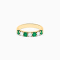 The 14K Yellow Gold 7-Stone Emerald & Diamond Band, 1.00 TCW, features alternating round white diamonds and vibrant emeralds set in a row, shown against a plain white background.