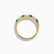 The 14K Yellow Gold 7-Stone Emerald & Diamond Band, 1.00 TCW, features alternating round white diamonds and vibrant emeralds set in a row, shown against a plain white background.
