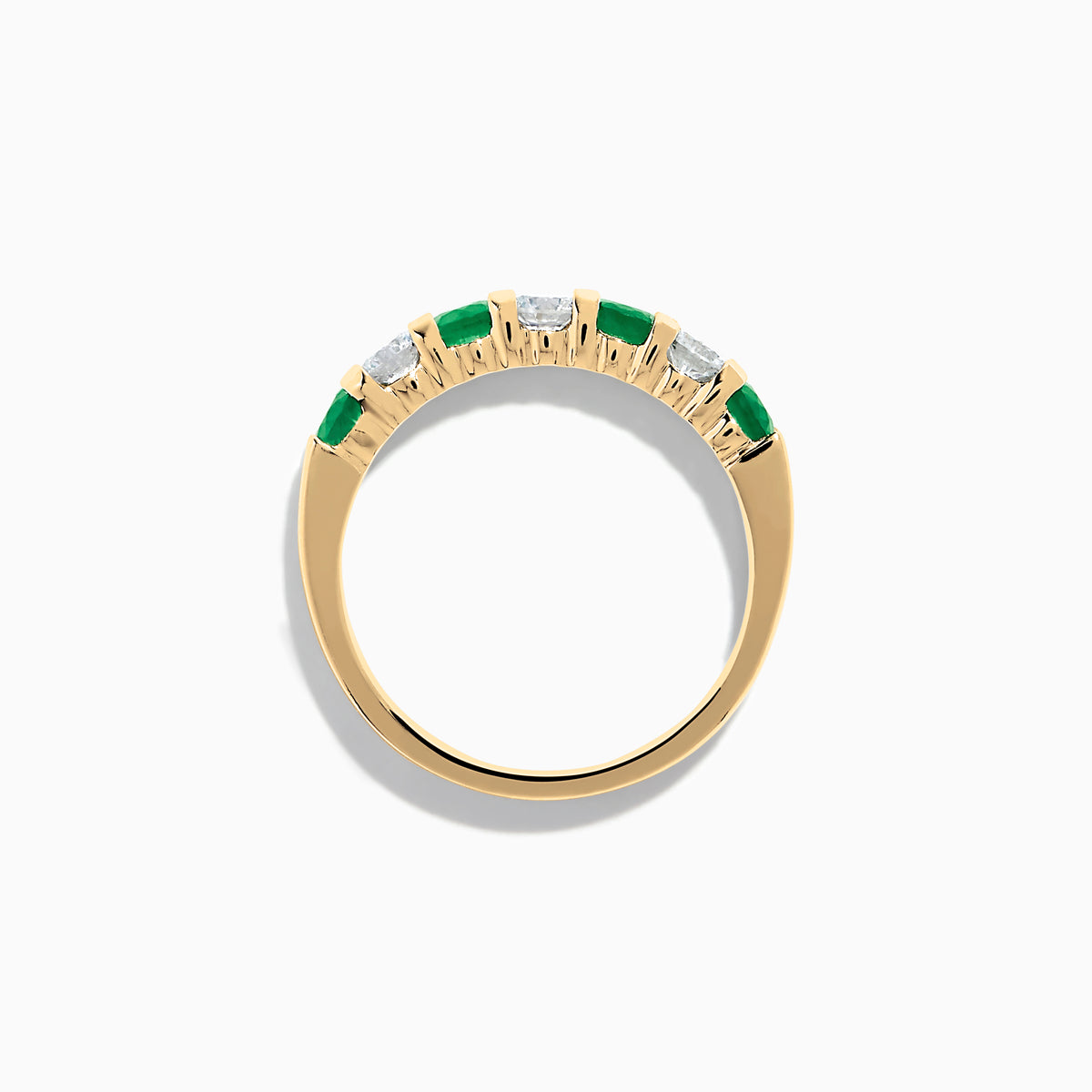 The 14K Yellow Gold 7-Stone Emerald & Diamond Band, 1.00 TCW, features alternating round white diamonds and vibrant emeralds set in a row, shown against a plain white background.