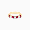 The 14K Yellow Gold 7-Stone Ruby & Diamond Band, 1.00 TCW, features alternating round rubies and clear diamonds set in a row along the band and is displayed on a white background.