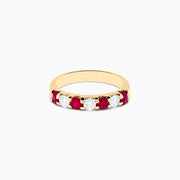 The 14K Yellow Gold 7-Stone Ruby & Diamond Band, 1.00 TCW, features alternating round rubies and clear diamonds set in a row along the band and is displayed on a white background.