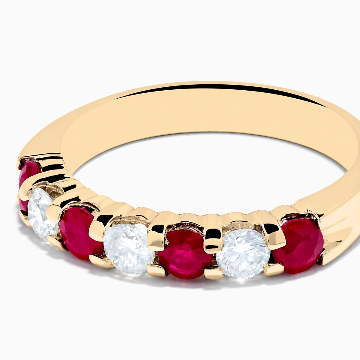 The 14K Yellow Gold 7-Stone Ruby & Diamond Band, 1.00 TCW, features alternating round rubies and clear diamonds set in a row along the band and is displayed on a white background.