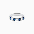 The 14K White Gold 7-Stone Blue Sapphire & Diamond Band, 1.00 TCW, features alternating round blue sapphires and white diamonds, displayed on a plain white background.