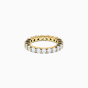 The 14K Yellow Gold Prong Set Diamond Eternity Band, 2.00 TCW, displays a seamless row of round white diamonds set in prongs on a plain white background.