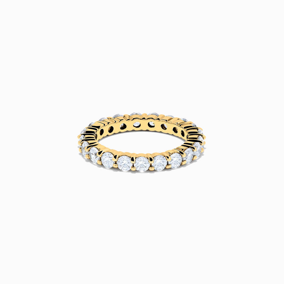 The 14K Yellow Gold Prong Set Diamond Eternity Band, 2.00 TCW, displays a seamless row of round white diamonds set in prongs on a plain white background.