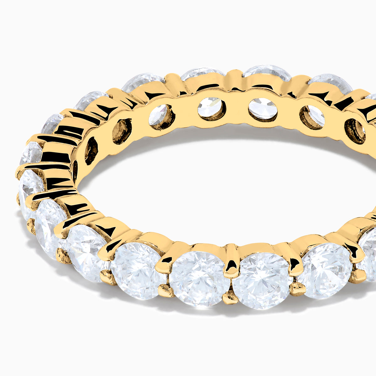 The 14K Yellow Gold Prong Set Diamond Eternity Band, 3.00 TCW, features round white diamonds encircling the entire ring and is shown against a plain white background.