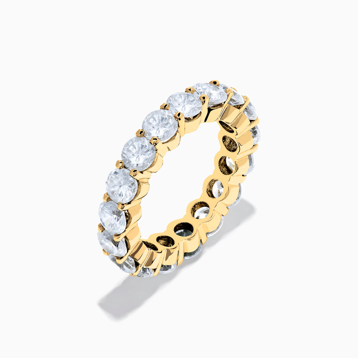 The 14K Yellow Gold Prong Set Diamond Eternity Band, 4.00 TCW, features round diamonds set all around and is shown against a plain white background.
