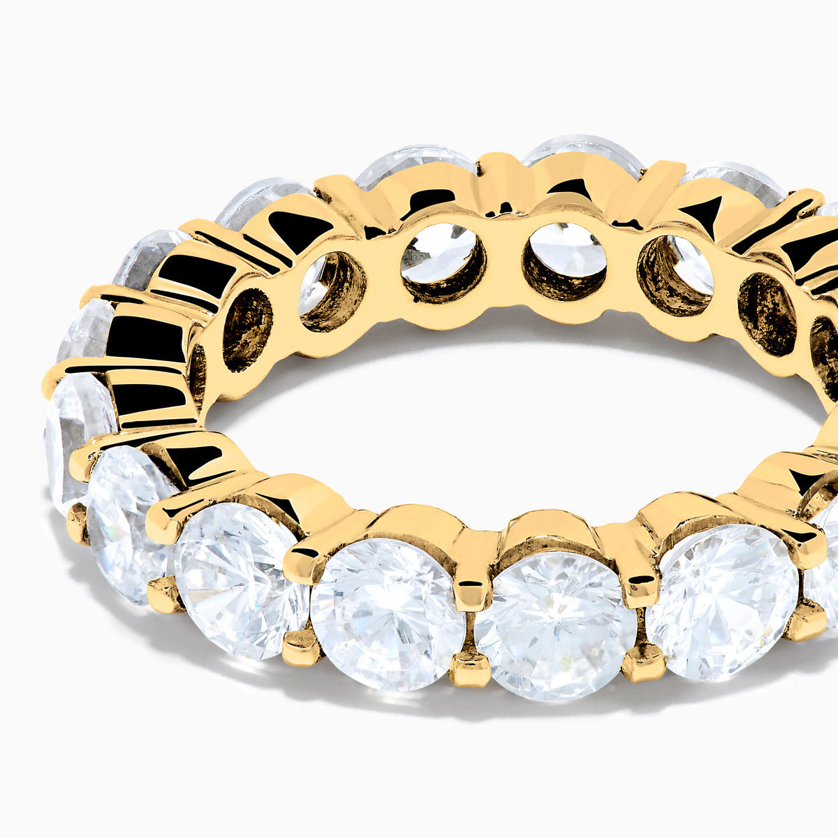 The 14K Yellow Gold Prong Set Diamond Eternity Band, 4.00 TCW, features round diamonds set all around and is shown against a plain white background.