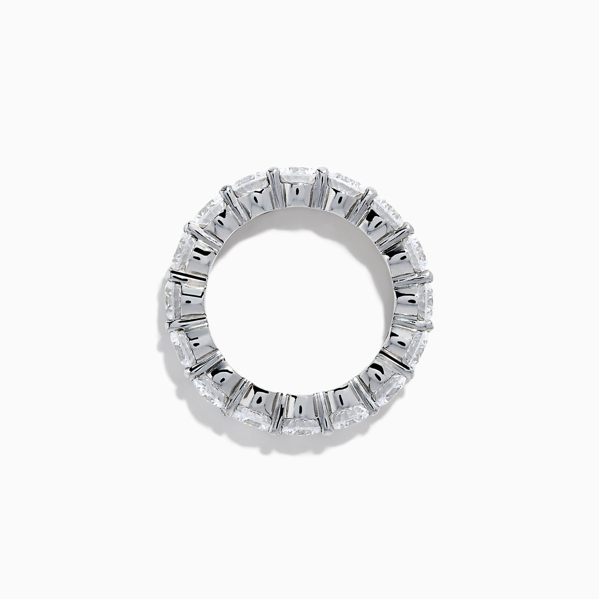 The 14K White Gold Prong Set Diamond Eternity Band, 5.00 TCW, features round diamonds encircling the band and is shown against a plain white background.