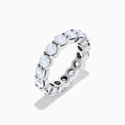 The 14K White Gold Prong Set Diamond Eternity Band, 5.00 TCW, features round diamonds encircling the band and is shown against a plain white background.