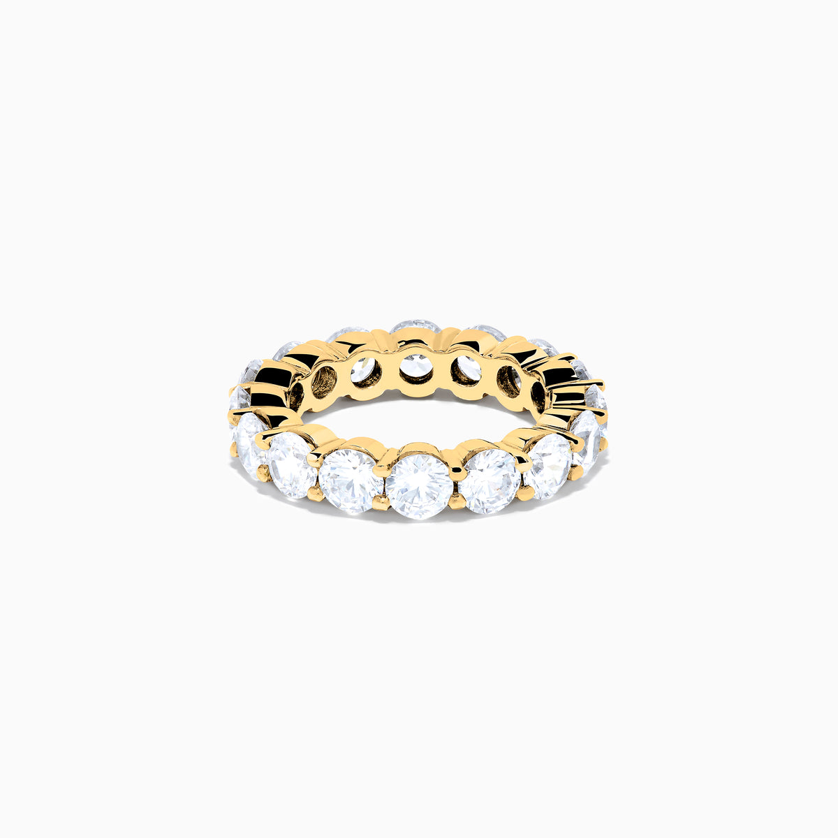 The 14K Yellow Gold Prong Set Diamond Eternity Band, 5.00 TCW, features a continuous row of round prong-set diamonds encircling the band, shown against a white background.