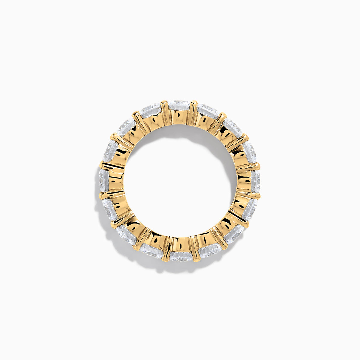 The 14K Yellow Gold Prong Set Diamond Eternity Band, 5.00 TCW, features a continuous row of round prong-set diamonds encircling the band, shown against a white background.