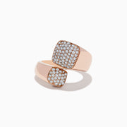 The Pave Rose 14K Rose Gold Diamond Bipass Ring features two square ends encrusted with sparkling diamonds, beautifully displayed on a white background.