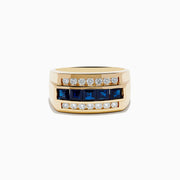 Men’s 14k Yellow Gold Blue Sapphire and Diamond Ring featuring a row of blue square-cut sapphires set between two rows of round white diamonds, displayed against a plain white background.