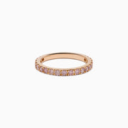 The 18K Rose Gold Pink Diamond Pavé Band Ring showcases a row of sparkling pink diamonds set along the band, photographed on a plain white background.