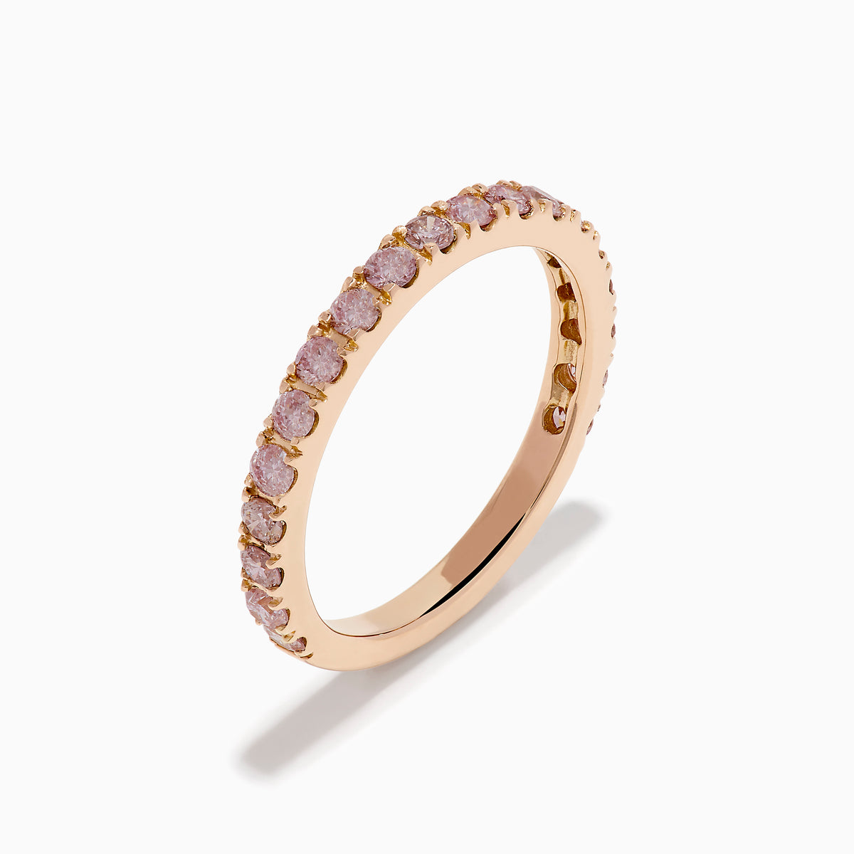 The 18K Rose Gold Pink Diamond Pavé Band Ring showcases a row of sparkling pink diamonds set along the band, photographed on a plain white background.