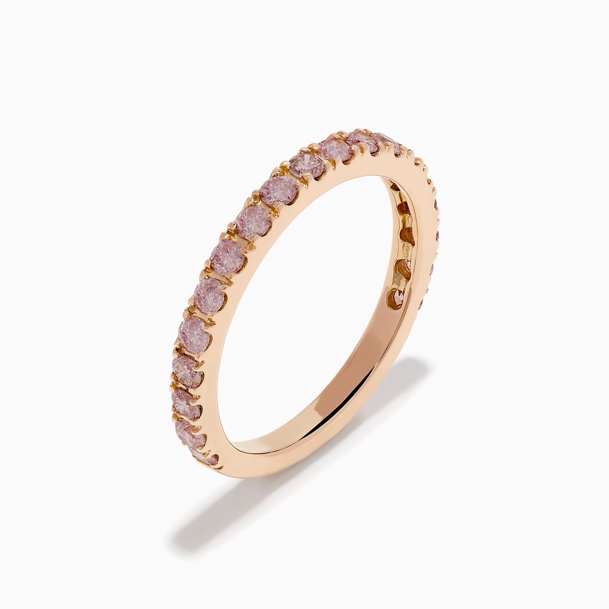 The 18K Rose Gold Pink Diamond Pavé Band Ring showcases a row of sparkling pink diamonds set along the band, photographed on a plain white background.