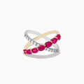 The 14K Two Tone Gold Ruby and Diamond Criss Cross Ring features intersecting gold and silver bands—one set with round diamonds, the other with oval rubies—for a strikingly elegant look.