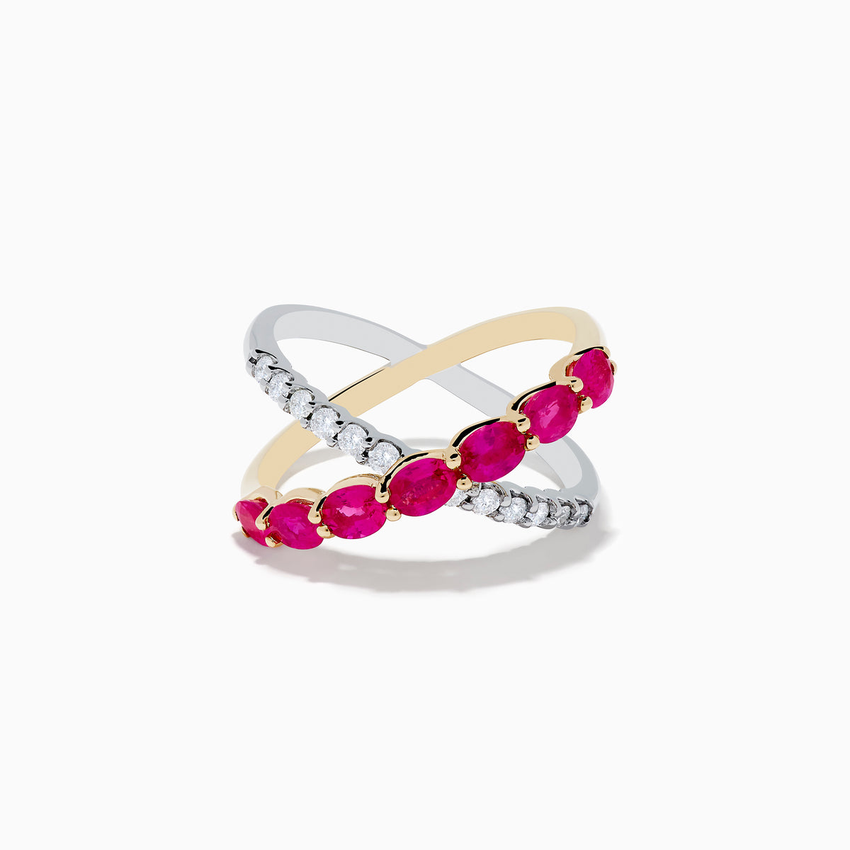 The 14K Two Tone Gold Ruby and Diamond Criss Cross Ring features intersecting gold and silver bands—one set with round diamonds, the other with oval rubies—for a strikingly elegant look.