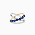 The Royale Bleu 14K Two Tone Gold Sapphire and Diamond Criss Cross Ring features alternating sapphires and clear diamonds, elegantly displayed against a white background.