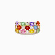 The Watercolors 14K Yellow Gold Multi Color Sapphire Three Row Ring features green, purple, red, orange, yellow, and blue sapphires with small round diamonds, all set against a white background.
